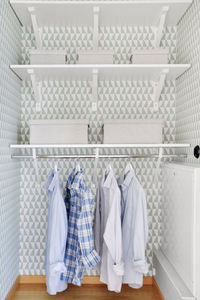 Clothes hanging in shelf