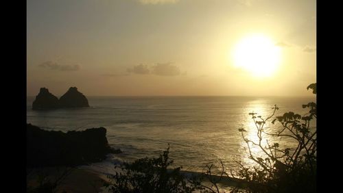 Scenic view of sea at sunset