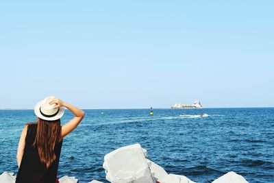 Rear view of woman looking at horizon