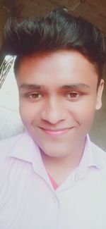 Close-up portrait of a smiling young woman