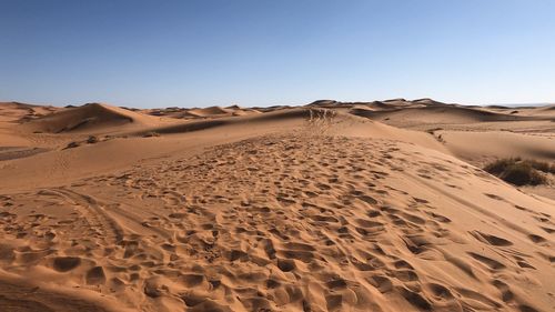 Scenic view of desert against clear sky