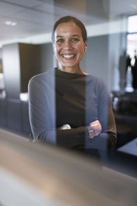 Businesswoman in office looking at camera