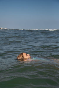 Girl swimming in sea