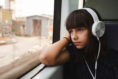 Portrait of young woman looking away