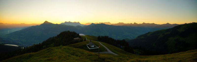 Scenic view of mountains against sky during sunset