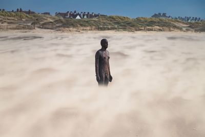 Rear view of man on beach