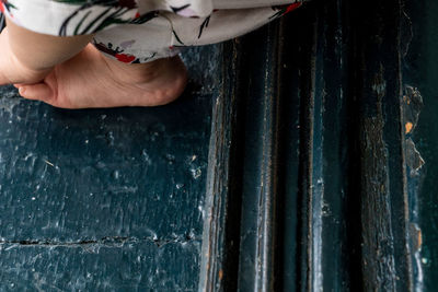 Close-up of person working on wood