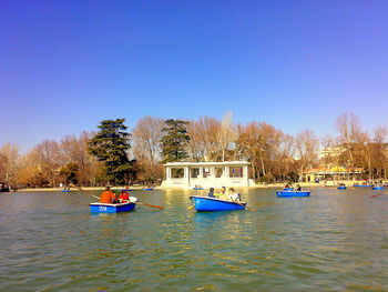 Scenic view of calm lake against blue sky