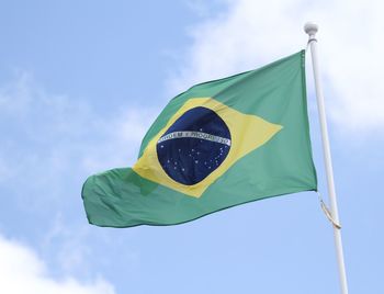 Low angle view of flag against sky