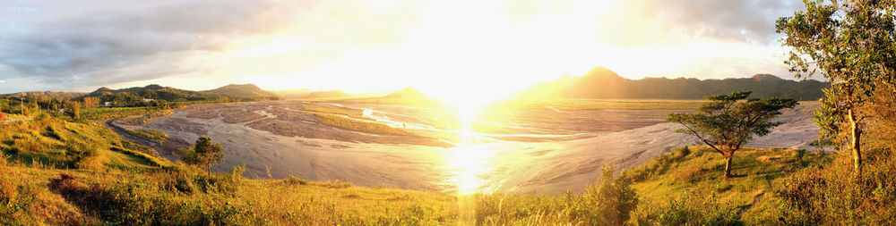 Panoramic view of landscape against sky during sunset