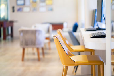 Empty chairs and tables in cafe