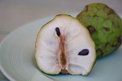 Close-up of fruit in plate on table