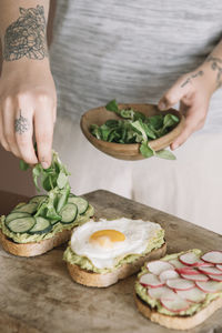 High angle view of person preparing food on table