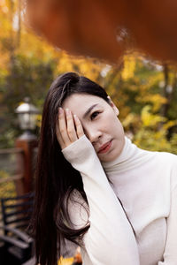 Portrait of young woman looking away