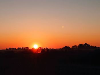 Scenic view of silhouette landscape against sky during sunset