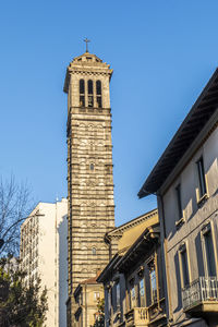 Low angle view of historic building against clear blue sky