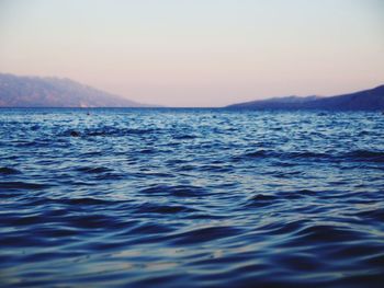 Scenic view of sea against clear sky during sunset