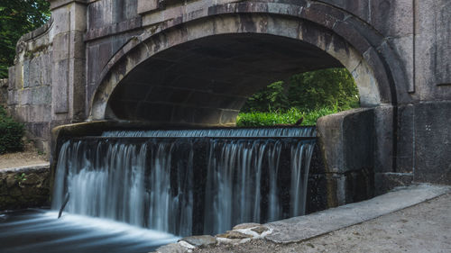 Arch bridge over stream