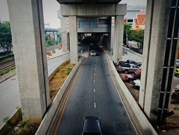 Empty road along buildings