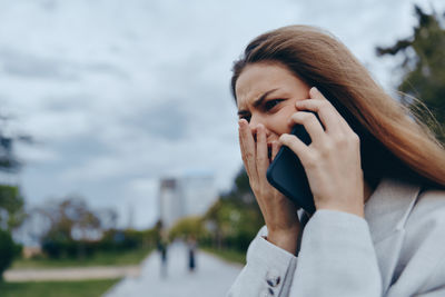 Young woman using mobile phone