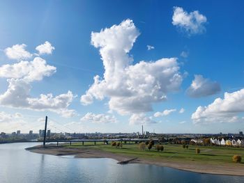 View of bridge over river against cloudy sky