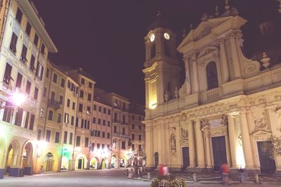 Illuminated buildings in city at night