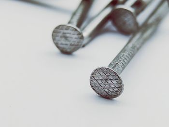 High angle view of nails against white background