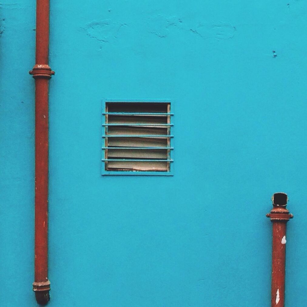 blue, built structure, architecture, copy space, clear sky, building exterior, protection, safety, security, low angle view, metal, no people, closed, outdoors, wall - building feature, day, sea, door, wall, lighting equipment