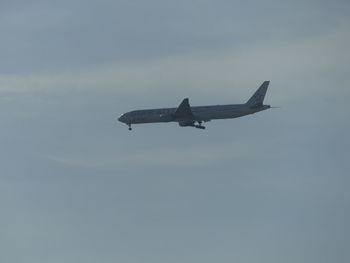 Low angle view of airplane flying in sky