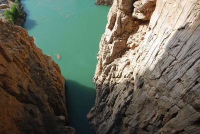 Scenic view of cliff by sea