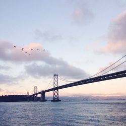 View of bridge against cloudy sky