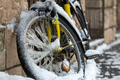 Close-up of a bicycle covered with ice and icicles