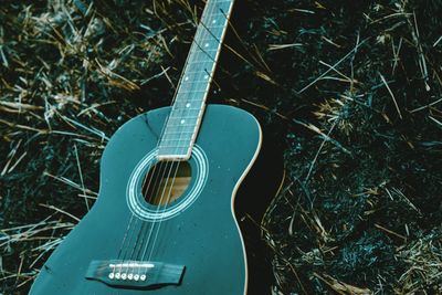 High angle view of guitar on field