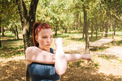 Young woman exercising in park