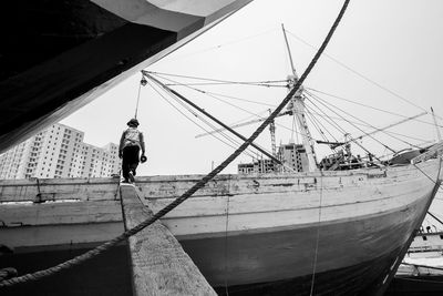 Man on sailboat against sky