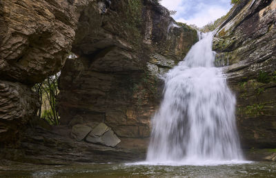 Scenic view of waterfall in forest