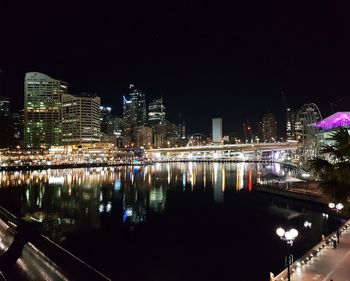 Illuminated city at waterfront