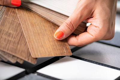 Cropped hand of person working on table