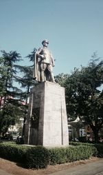 Low angle view of statue against sky