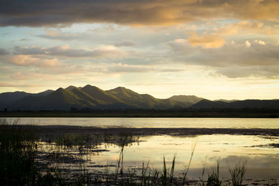 Scenic view of lake against sky during sunset