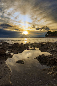 Scenic view of sea against sky during sunset