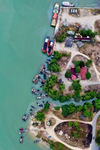 High angle view of cars on road by sea