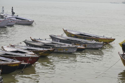 Fishing boats moored in sea