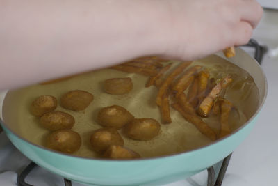 Close-up of hand holding ice cream