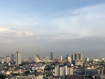 Modern buildings in city against sky