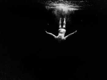 Man swimming in water