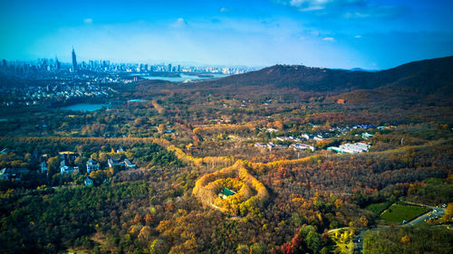 High angle view of trees and buildings against sky