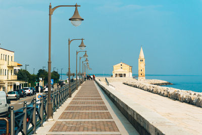 Panoramic view of sea and buildings against sky