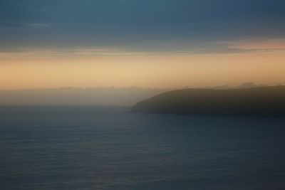 Scenic view of sea at sunset