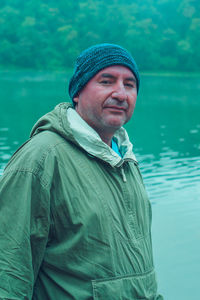 Portrait of man wearing hat standing in water